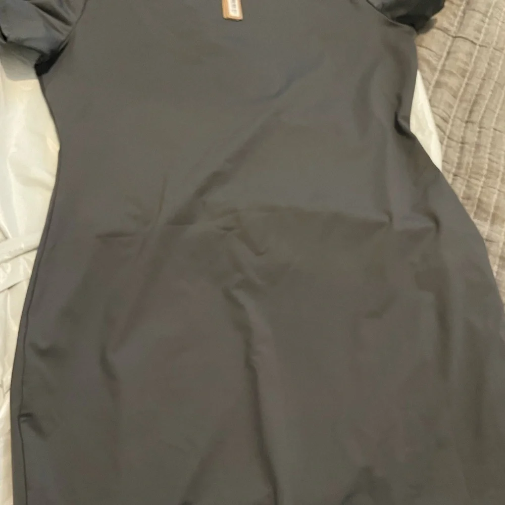 Skims recycled swim dress.
